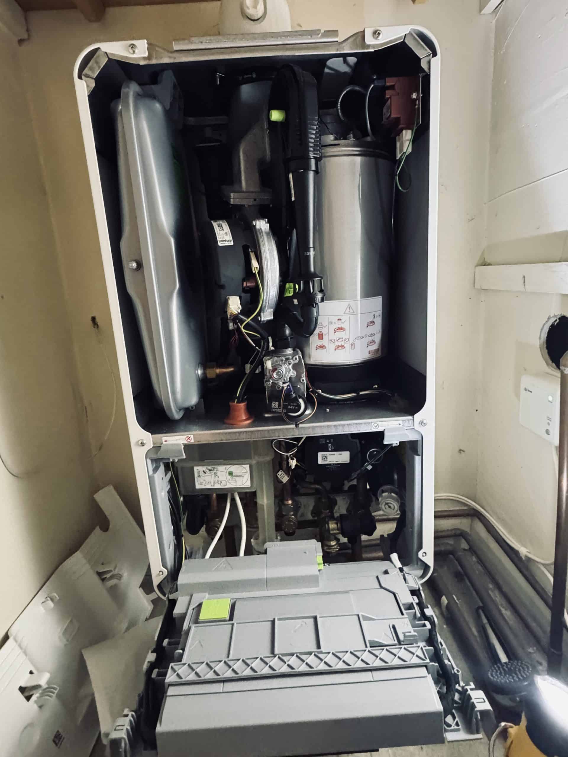 Let’s Heat engineer carrying out boiler inspection and repair work